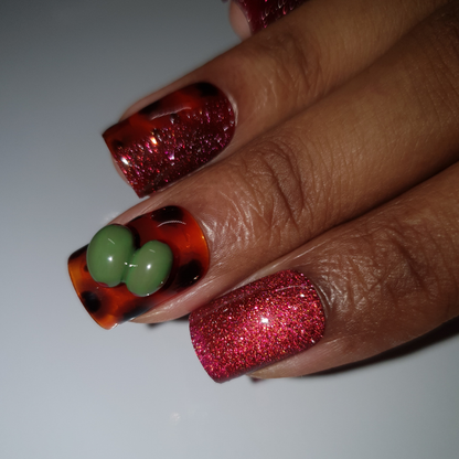 Red reflective cat-eye color, tortoise nail-art and 3d olives worn on square shaped press-on nails