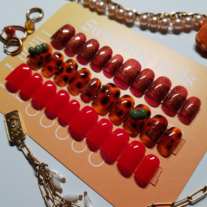 Bundle of 3 sets of red press-on nails: solid color, reflective cat-eye, and mix&match